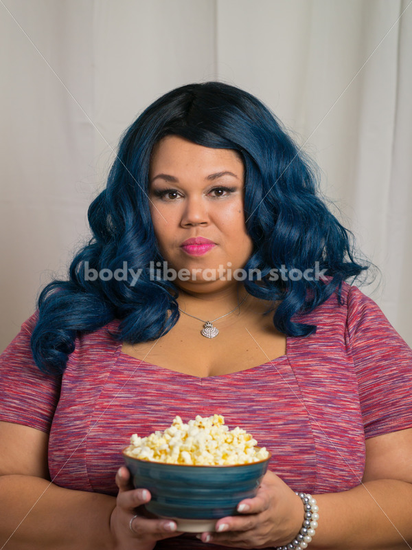 Royalty Free Stock Photo: Plus Size Black Woman with Bowl of Popcorn - Body Liberation Photos