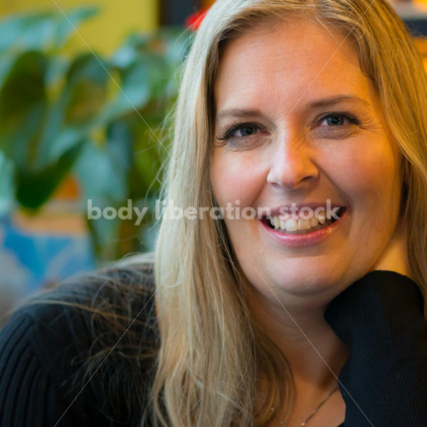 Royalty Free Stock Photo: Plus Size Woman Close-up in Coffee Shop - Body Liberation Photos