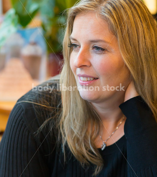 Royalty Free Stock Photo: Plus Size Woman Close-up in Coffee Shop - Body Liberation Photos