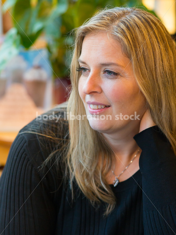 Royalty Free Stock Photo: Plus Size Woman Close-up in Coffee Shop - Body Liberation Photos
