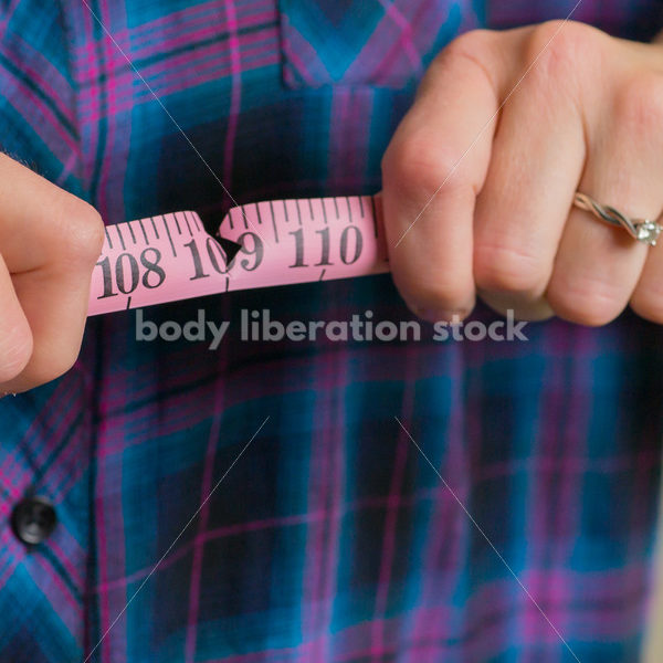 Royalty Free Stock Photo for Dieting Recovery: Woman Breaking Tape Measure - Body Liberation Photos