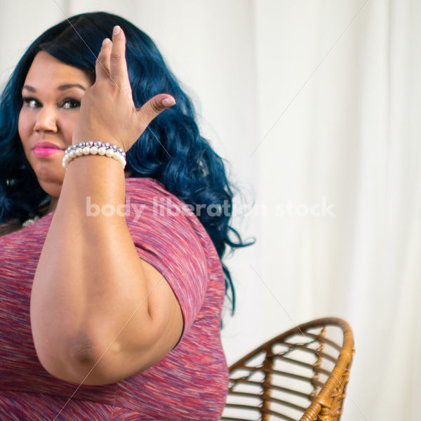 Royalty Free Stock Photo for Intuitive Eating: Black Woman Throws Head of Lettuce Over Shoulder - Body Liberation Photos