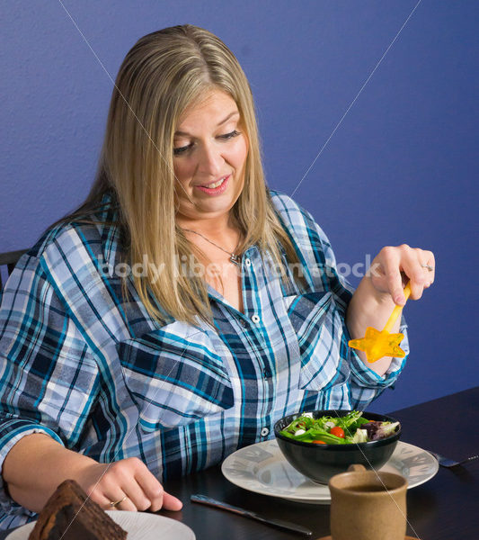 Royalty Free Stock Photo for Intuitive Eating: Plus Size Woman Chooses from Variety of Foods on Dining Table - Body Liberation Photos