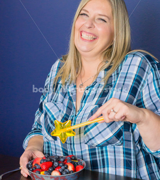 Royalty Free Stock Photo for Intuitive Eating: Plus Size Woman Chooses from Variety of Foods on Dining Table - Body Liberation Photos