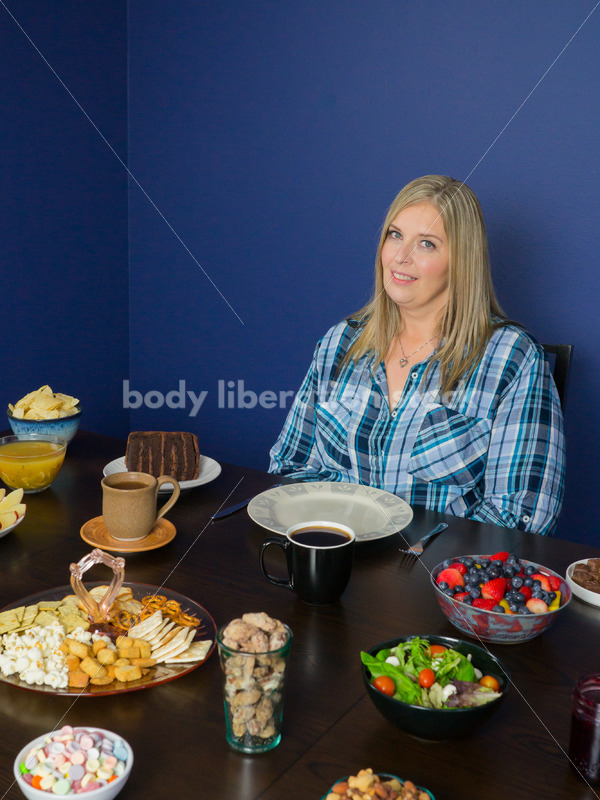 Royalty Free Stock Photo for Intuitive Eating: Plus Size Woman Considers Variety of Foods on Dining Table - Body Liberation Photos