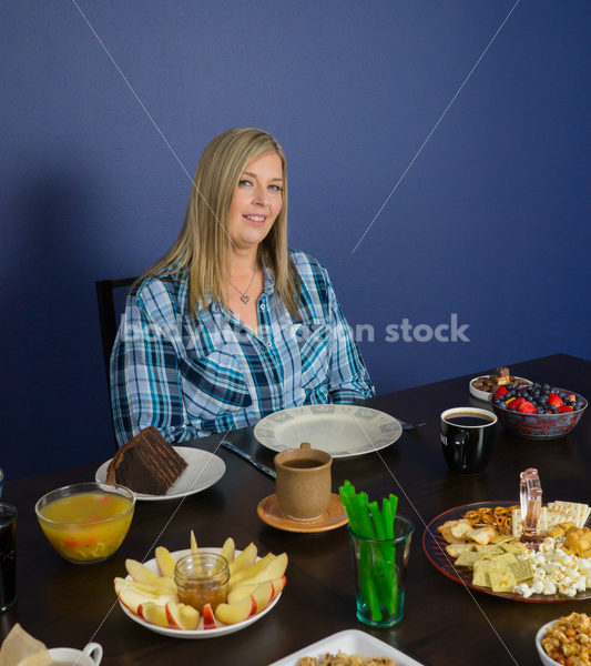 Royalty Free Stock Photo for Intuitive Eating: Plus Size Woman Considers Variety of Foods on Dining Table - Body Liberation Photos