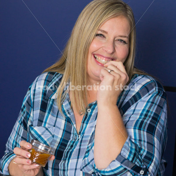 Royalty Free Stock Photo for Intuitive Eating: Plus Size Woman Eats Caramel Dip - Body Liberation Photos