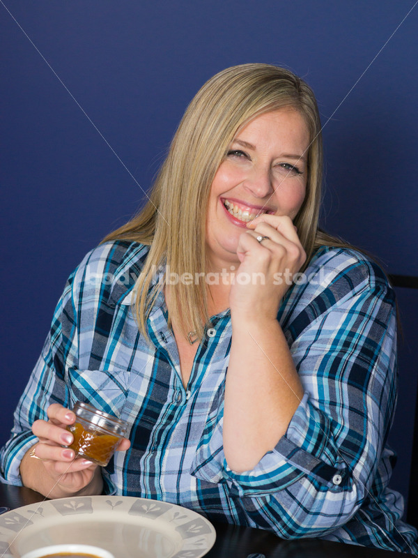 Royalty Free Stock Photo for Intuitive Eating: Plus Size Woman Eats Caramel Dip - Body Liberation Photos