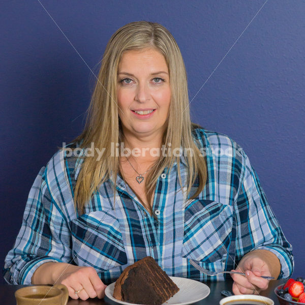 Royalty Free Stock Photo for Intuitive Eating: Plus Size Woman Eats Chocolate Cake, Nothing Bad Happens - Body Liberation Photos