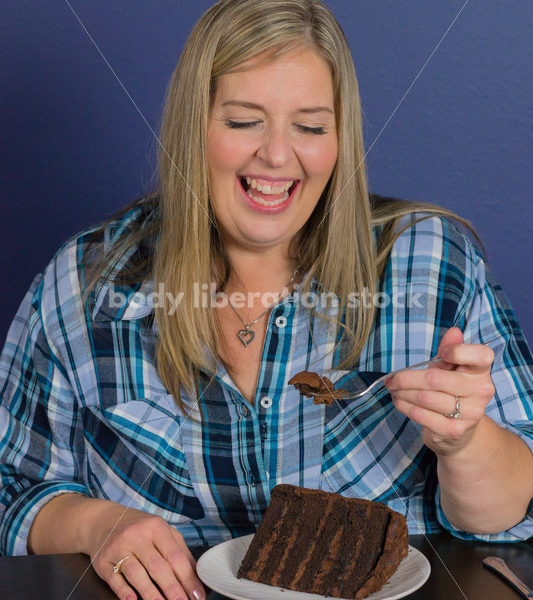 Royalty Free Stock Photo for Intuitive Eating: Plus Size Woman Eats Chocolate Cake, Nothing Bad Happens - Body Liberation Photos