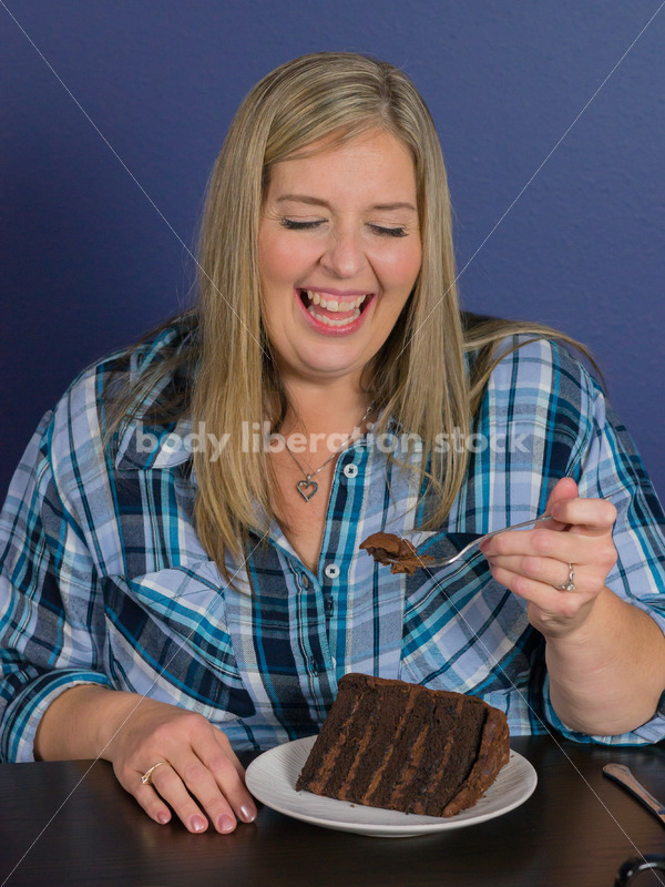 Royalty Free Stock Photo for Intuitive Eating: Plus Size Woman Eats Chocolate Cake, Nothing Bad Happens - Body Liberation Photos