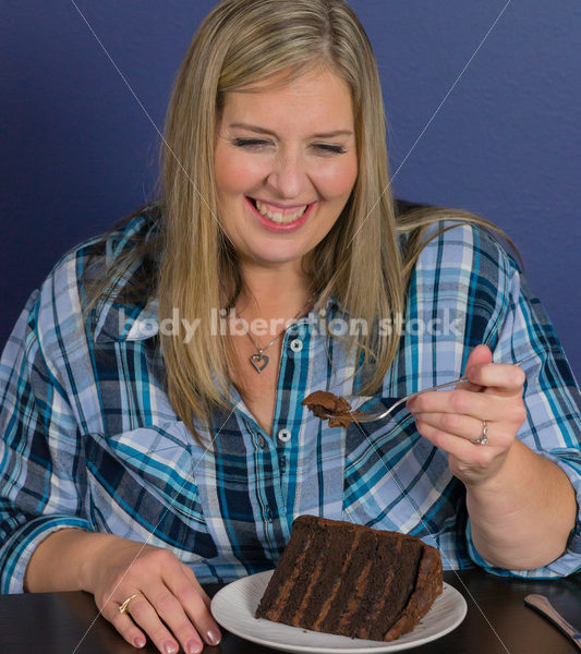 Royalty Free Stock Photo for Intuitive Eating: Plus Size Woman Eats Chocolate Cake, Nothing Bad Happens - Body Liberation Photos