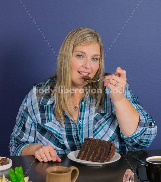 Royalty Free Stock Photo for Intuitive Eating: Plus Size Woman Eats Chocolate Cake, Nothing Bad Happens - Body Liberation Photos