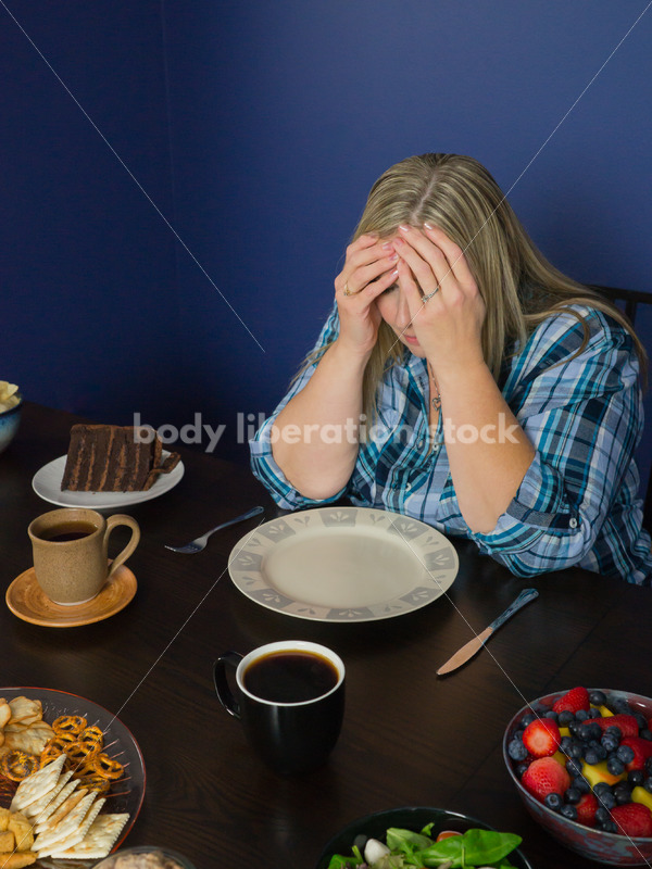 Royalty Free Stock Photo for Intuitive Eating: Plus Size Woman Overwhelmed by Variety of Foods on Dining Table - Body Liberation Photos