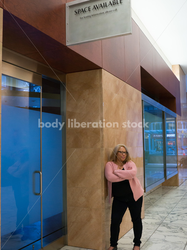 Small Business Stock Image: Black LGBT Businesswoman with Vacant Storefront - Body Liberation Photos