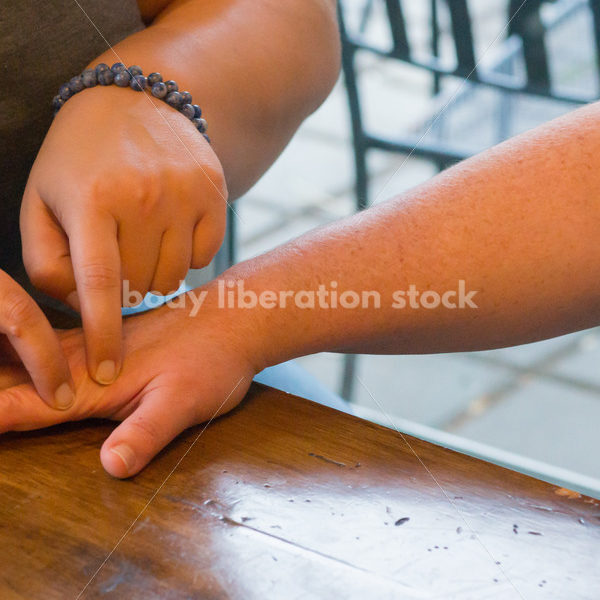 Stock Photo: Acupuncture Student Palpates to Locate Large Intestine Acupuncture Points - Body Liberation Photos