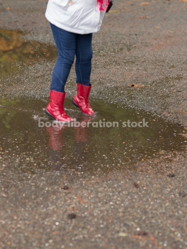 Stock Photo: Asian American Woman Playing in Puddles on a Rainy Day - Body Liberation Photos