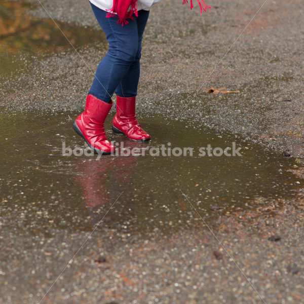 Stock Photo: Asian American Woman Playing in Puddles on a Rainy Day - Body Liberation Photos