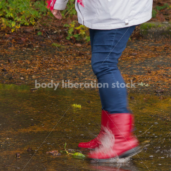 Stock Photo: Asian American Woman Playing in Puddles on a Rainy Day - Body Liberation Photos