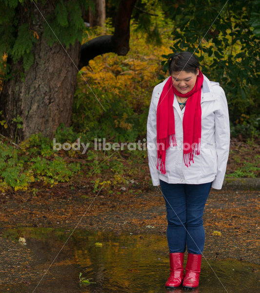 Stock Photo: Asian American Woman Playing in Puddles on a Rainy Day - Body Liberation Photos