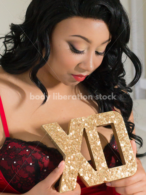 Stock Photo: Close-up of African American Woman with Romantic XO Valentine’s Day Sign - Body Liberation Photos