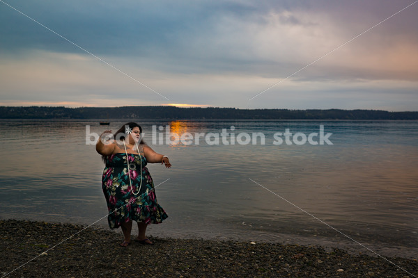 Stock Photo: Joyful Movement Pacific Islander Woman Hula Dancing on Beach at Sunset - Body Liberation Photos