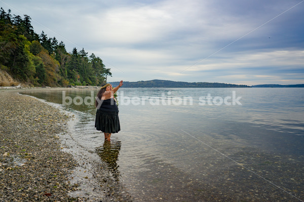 Stock Photo: Joyful Movement Pacific Islander Woman Hula Dancing on Beach at Twilight - Body Liberation Photos