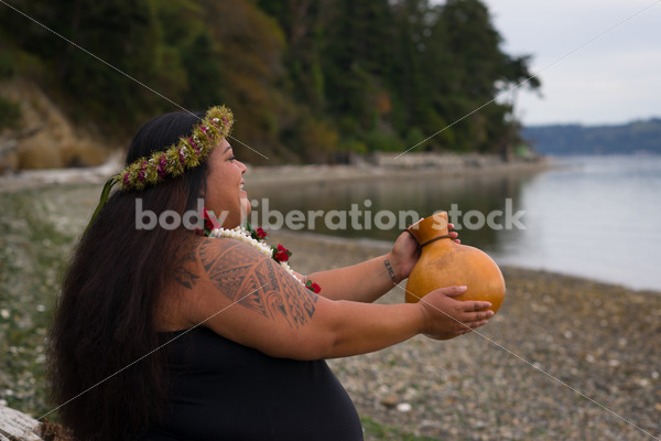 Stock Photo: Pacific Islander Woman Hula Dancing on Evening Pebbled Beach - Body Liberation Photos