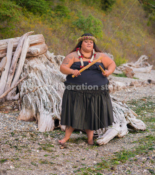 Stock Photo: Pacific Islander Woman Hula Dancing on Evening Pebbled Beach - Body Liberation Photos