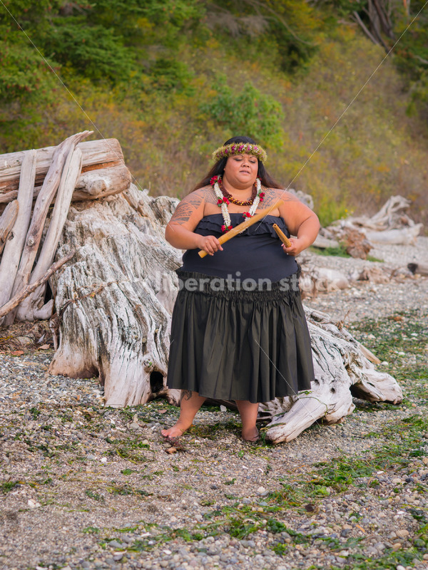 Stock Photo: Pacific Islander Woman Hula Dancing on Evening Pebbled Beach - Body Liberation Photos