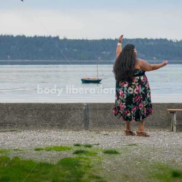 Stock Photo: Pacific Islander Woman Hula Dancing with Cabins on Evening Shore - Body Liberation Photos