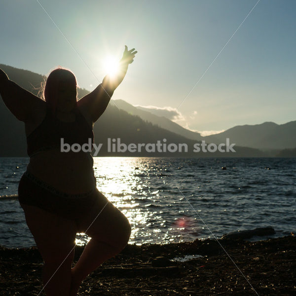 Stock Photo: Plus Size Woman Practices Yoga on Mountain Lake Shore at Sunset - Body positive stock and client photography + more | Seattle