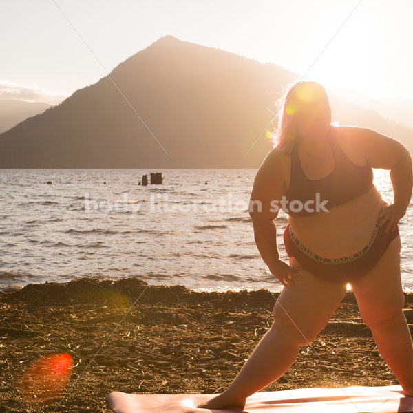 Stock Photo: Plus Size Woman Practices Yoga on Mountain Lake Shore at Sunset - Body positive stock and client photography + more | Seattle