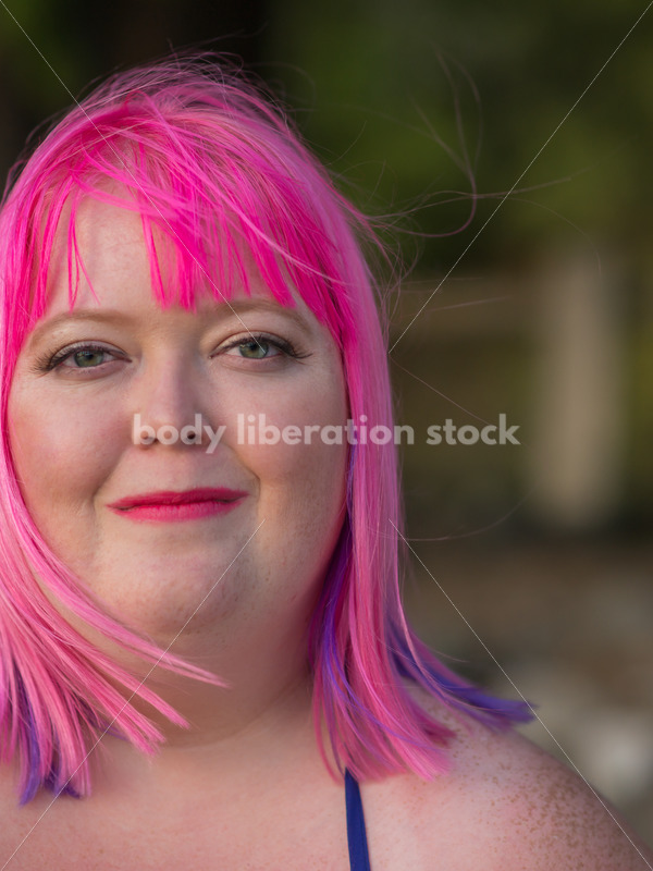 Stock Photo: Plus Size Woman with Pink Hair Close-up on Evening Lake Shore - Body Liberation Photos