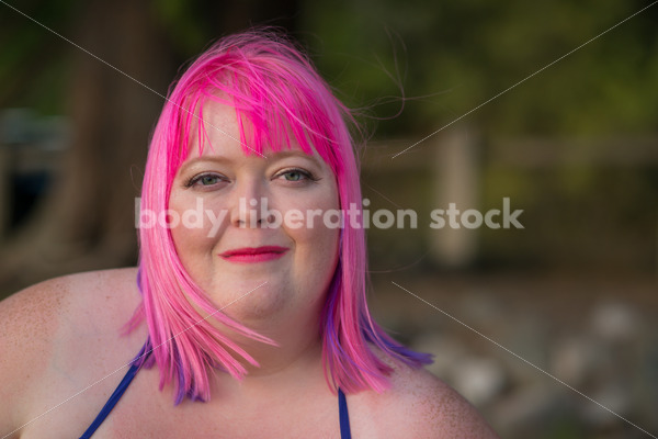 Stock Photo: Plus Size Woman with Pink Hair Close-up on Evening Lake Shore - Body Liberation Photos