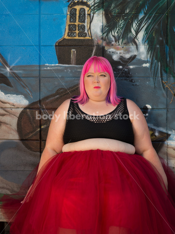 Stock Photo: Plus Size Woman with Pink Hair Seated in Tutu with Mural - Body Liberation Photos