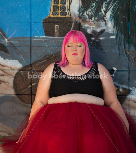 Stock Photo: Plus Size Woman with Pink Hair Seated in Tutu with Mural - Body Liberation Photos