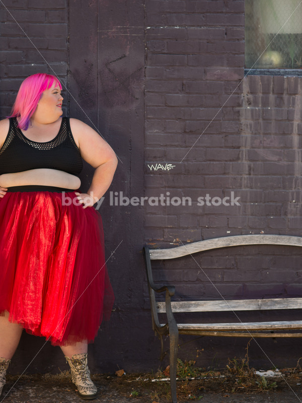 Stock Photo: Plus Size Woman with Pink Hair Standing with Purple Brick Wall - Body Liberation Photos