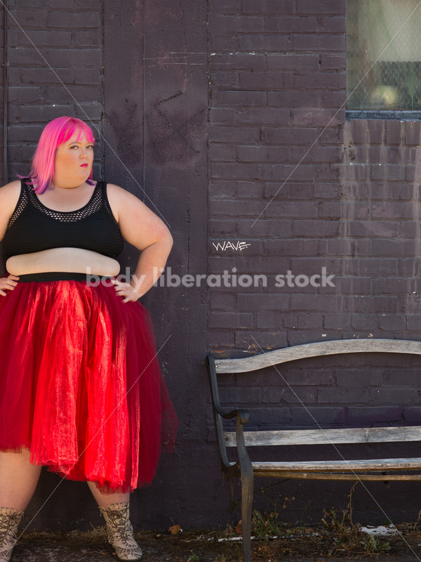 Stock Photo: Plus Size Woman with Pink Hair Standing with Purple Brick Wall - Body Liberation Photos