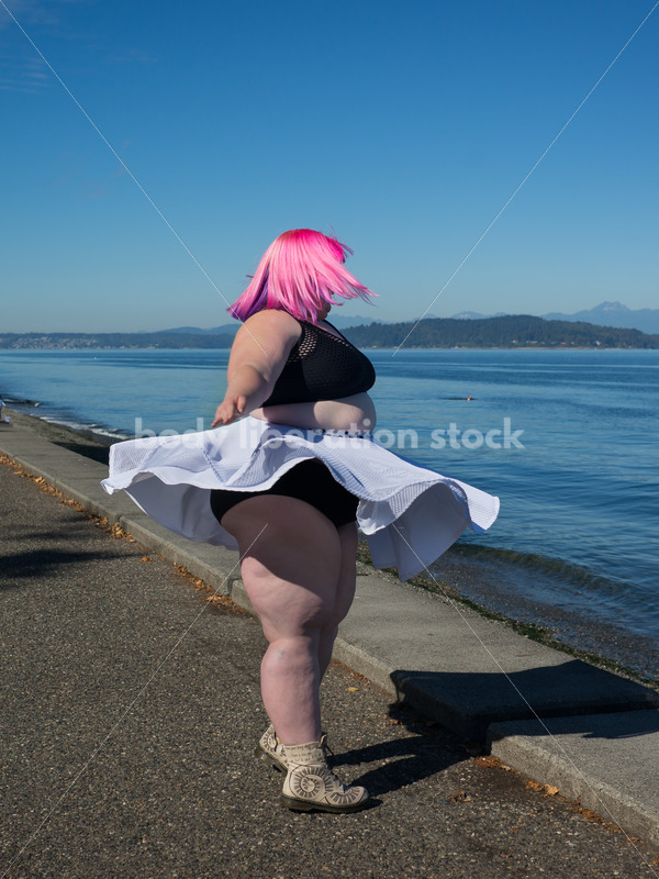 Stock Photo: Plus Size Woman with Pink Hair Twirls near Water - Body Liberation Photos