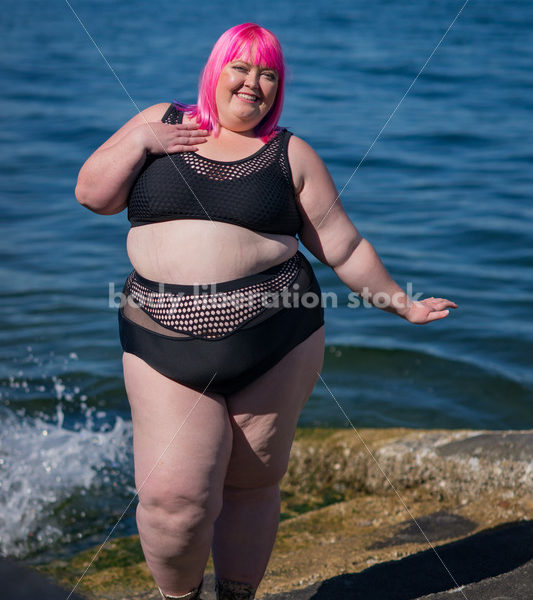 Stock Photo: Plus Size Woman with Pink Hair in Bikini near Water - Body Liberation Photos