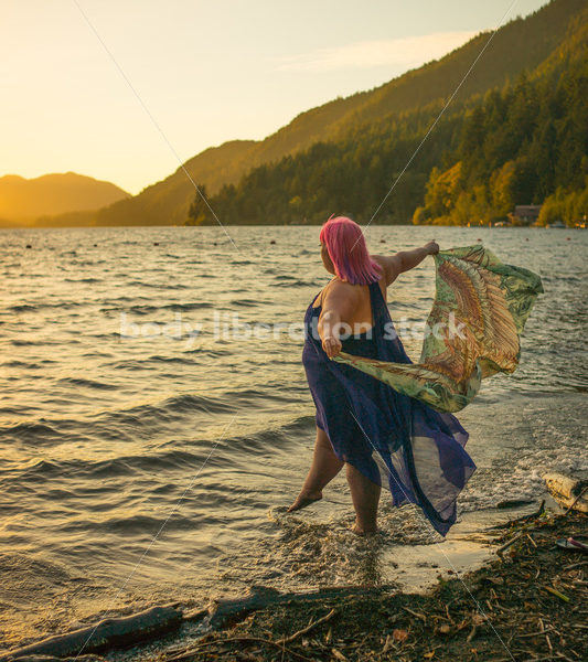 Stock Photo: Plus Size Woman with Scarf on Sunset Lake Shore - Body Liberation Photos