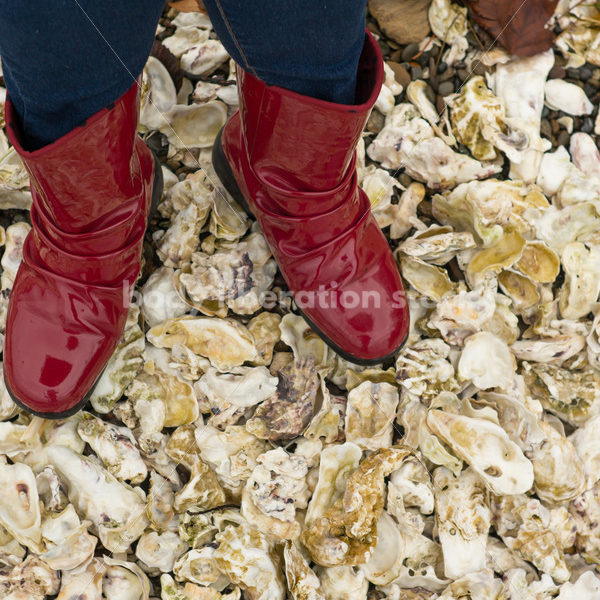 Stock Photo: Red Boots on Oyster Shell Shore - Body Liberation Photos