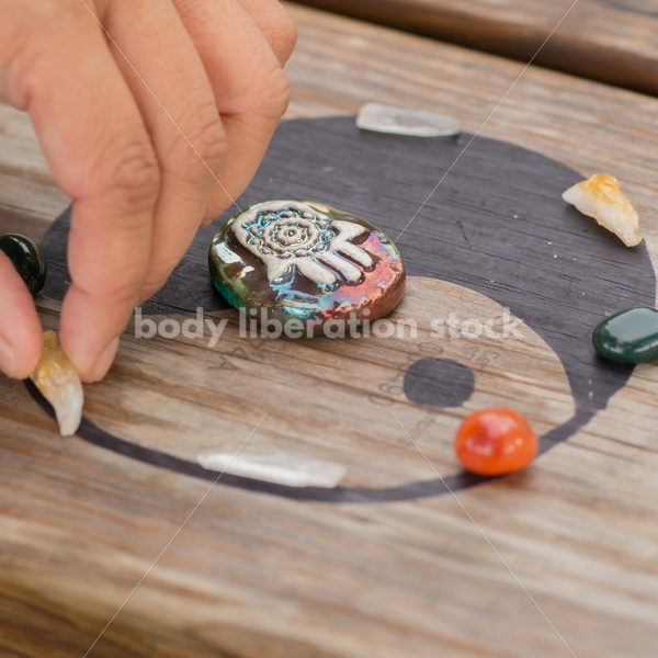 Stock Photo: Scrying, Clearing Gemstones and Pendulum Work with Yin and Yang and Asian American Hand - Body Liberation Photos