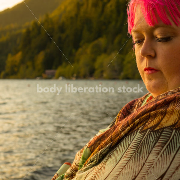 Stock Photo: Thoughtful Woman on Sunset Lake Shore - Body Liberation Photos