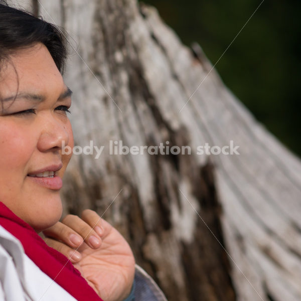 Stock Photo: Young Asian American Outdoors with Tree Trunk - Body Liberation Photos