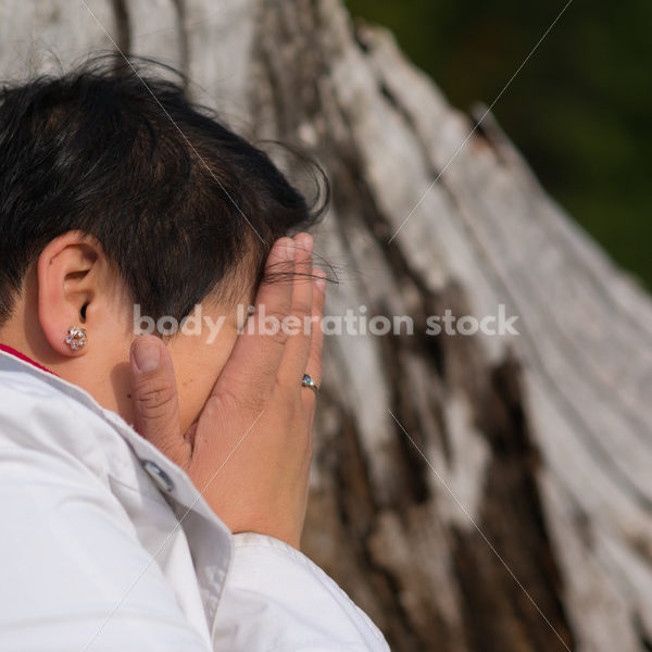 Stock Photo: Young Asian American Outdoors with Tree Trunk - Body Liberation Photos