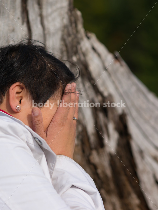 Stock Photo: Young Asian American Outdoors with Tree Trunk - Body Liberation Photos