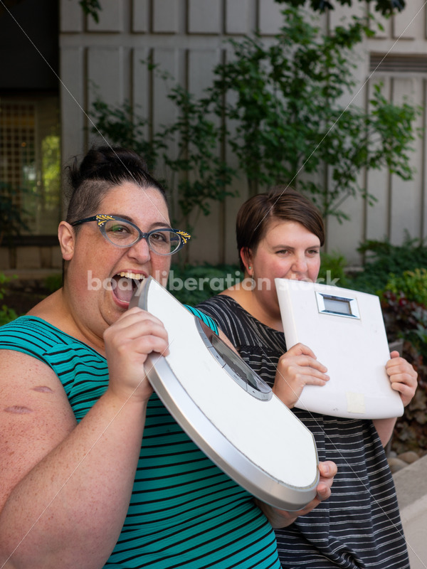 Anti-Diet Stock Image: Women “Eat” Bathroom Scales - Body Liberation Photos