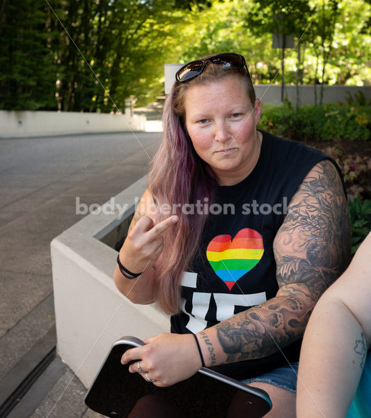 Anti-Diet Stock Image: Women Give the Finger to Bathroom Scales - Body Liberation Photos